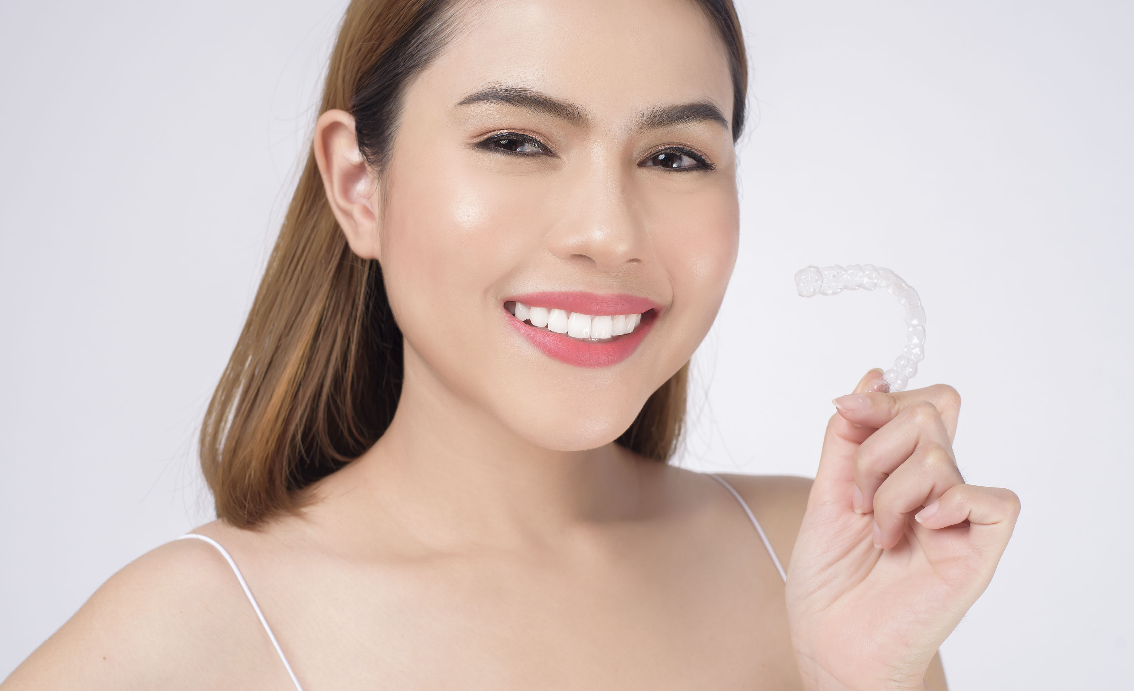 Woman holding SnapCorrect Aligner